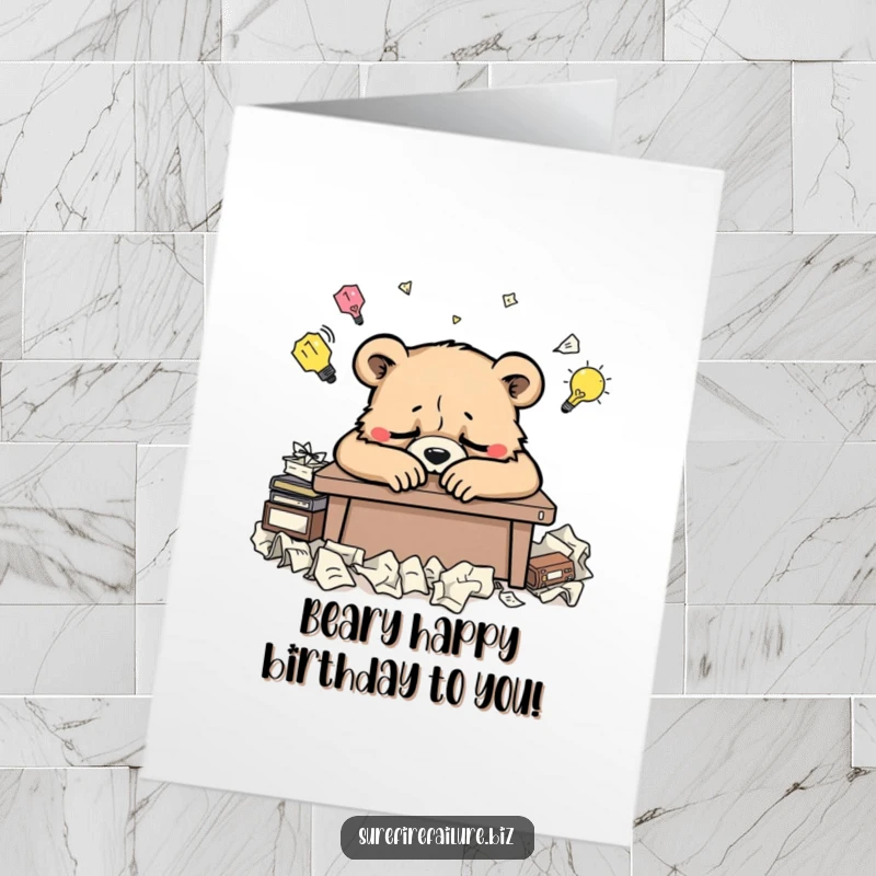 Funny Free Printable Birthday Card featuring a weary bear slouched over a desk with crumpled ideas.